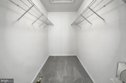 a view of a room with racks on the wall