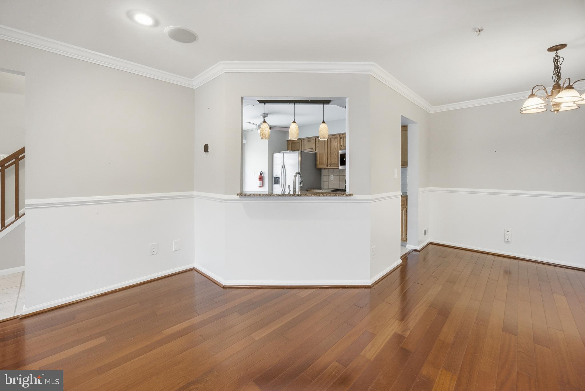 1401 Wharton Road Mount Laurel, NJ 08054 - Photo 9 of 40 an empty room with wooden floor and cabinet