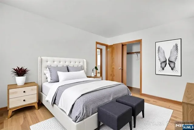 a bedroom with a bed and a couch