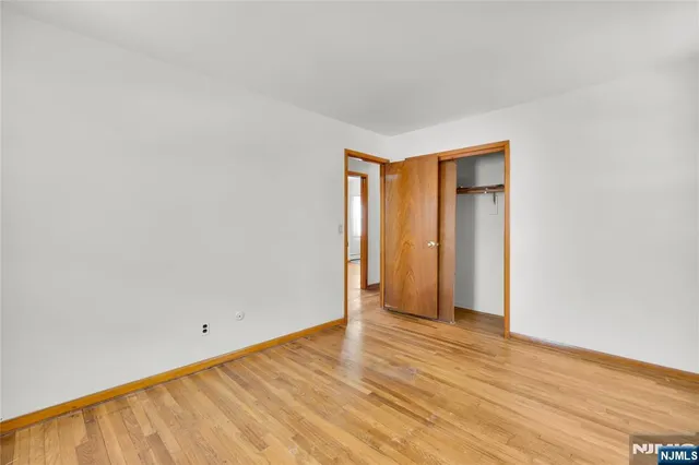 a view of an empty room with wooden walls