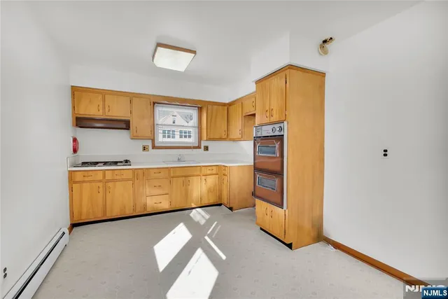 a view of a white house with large windows