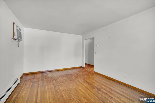 a view of a dining room with furniture and a potted plant