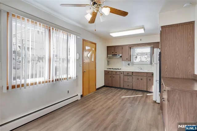 a bathroom with a sink and mirror with toilet