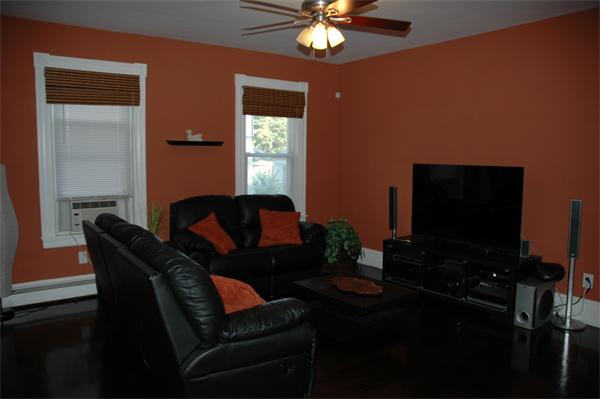 126 Mammoth Road Lowell, MA 01854 - Photo 12 of 23 a living room with furniture and a flat screen tv