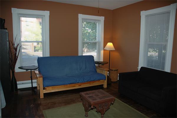 126 Mammoth Road Lowell, MA 01854 - Photo 13 of 23 a living room with furniture and a lamp