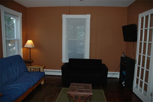 126 Mammoth Road Lowell, MA 01854 - Photo 14 of 23 a living room with furniture and a lamp