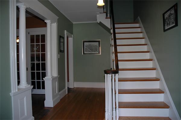 126 Mammoth Road Lowell, MA 01854 - Photo 15 of 23 a view of entryway and hall with wooden floor
