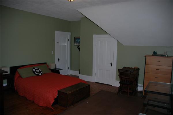 126 Mammoth Road Lowell, MA 01854 - Photo 17 of 23 a bedroom with a bed and furniture