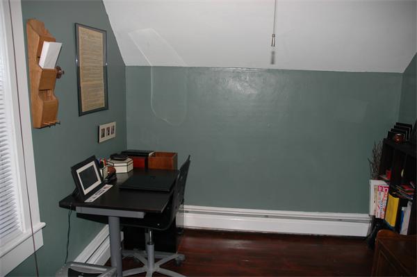 126 Mammoth Road Lowell, MA 01854 - Photo 19 of 23 a view of a workspace with furniture and wooden floor