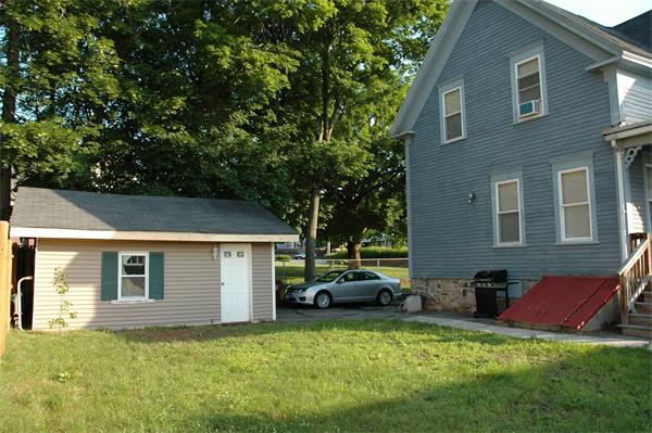 126 Mammoth Road Lowell, MA 01854 - Photo 3 of 23 a view of a house with a patio