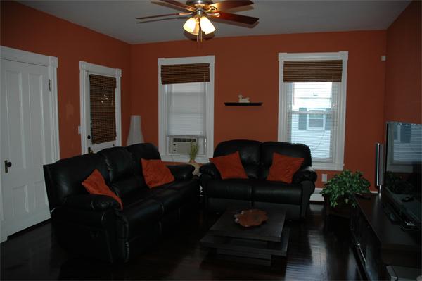 126 Mammoth Road Lowell, MA 01854 - Photo 10 of 23 a living room with furniture and a flat screen tv