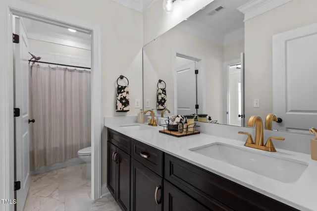 a bathroom with a double vanity sink mirror and double