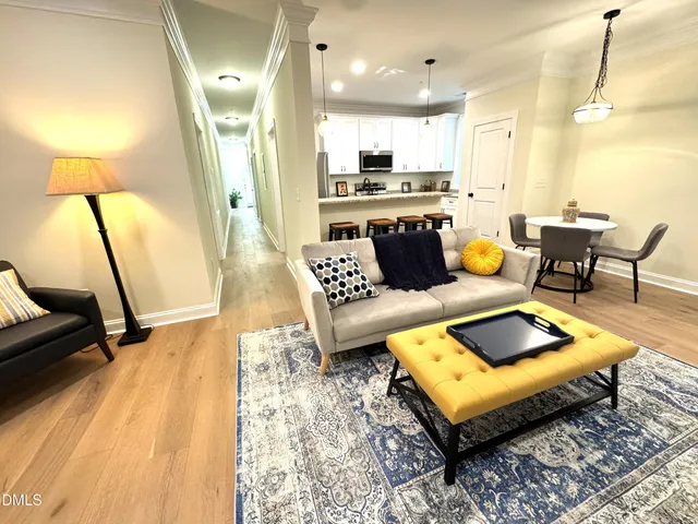 a living room with furniture and a table