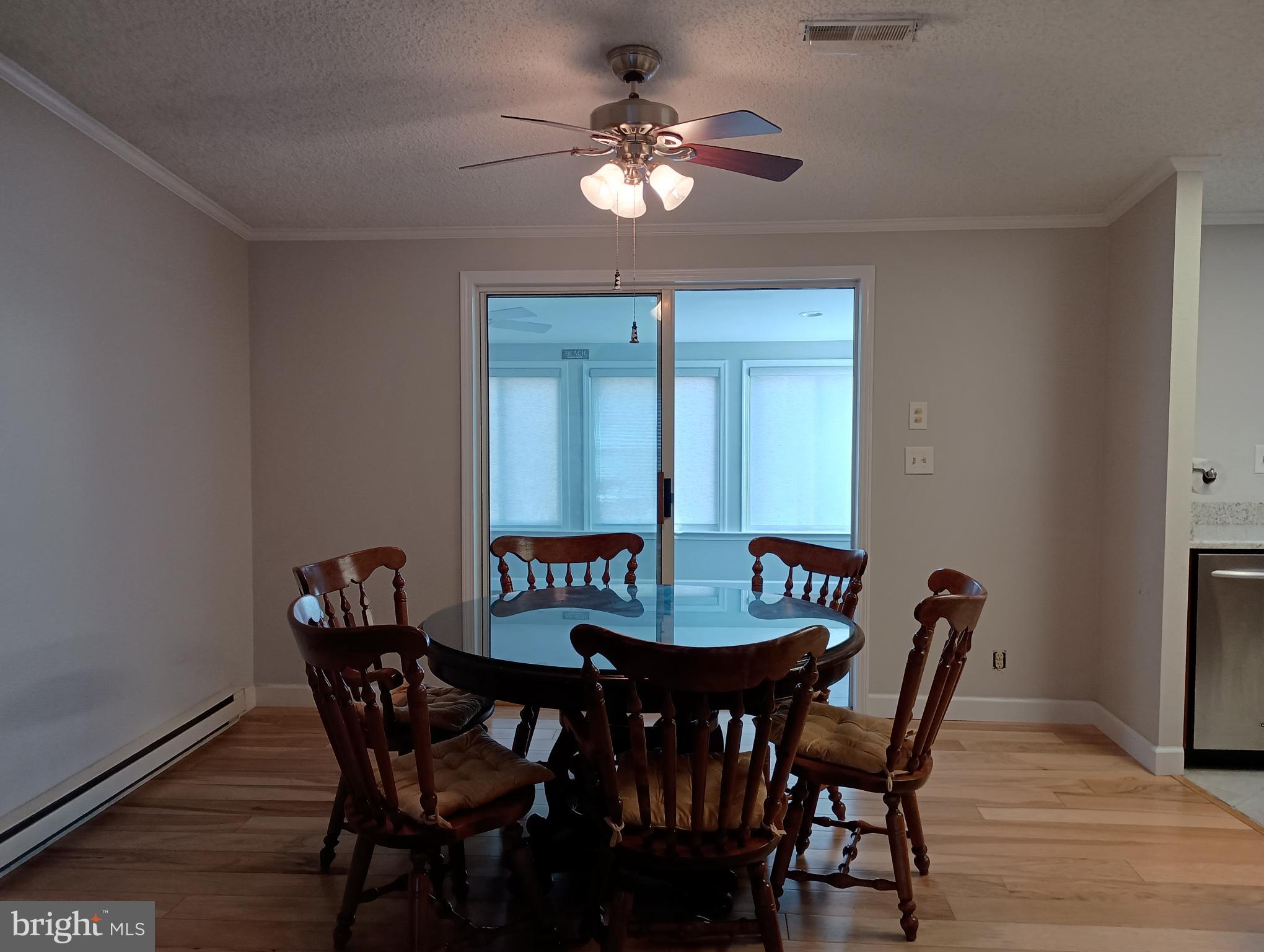 32217 Sandpiper Drive Lewes, DE 19958 - Photo 5 of 21 a view of a dining room with furniture and a chandelier