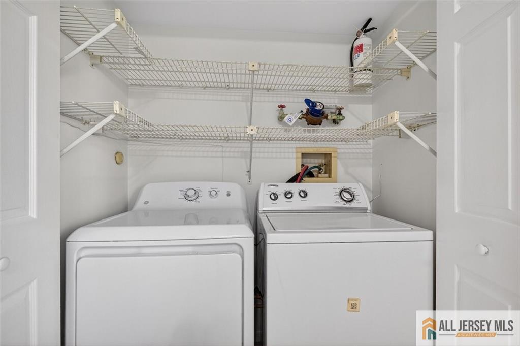 40C Rutland Lane, Unit 40B Monroe Township, NJ 08831 - Photo 15 of 37 a utility room with dryer and washer