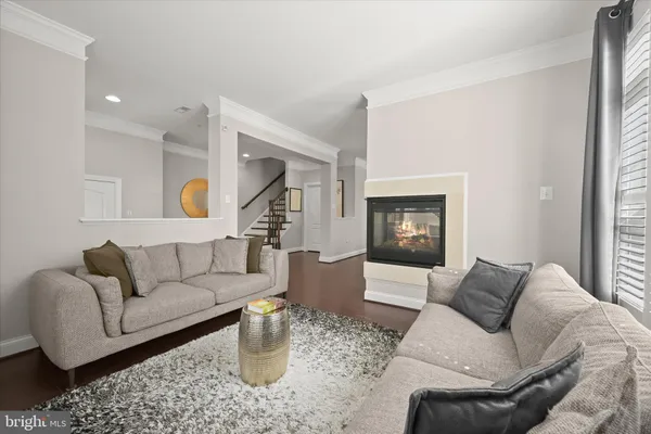 a living room with fireplace furniture and a fireplace