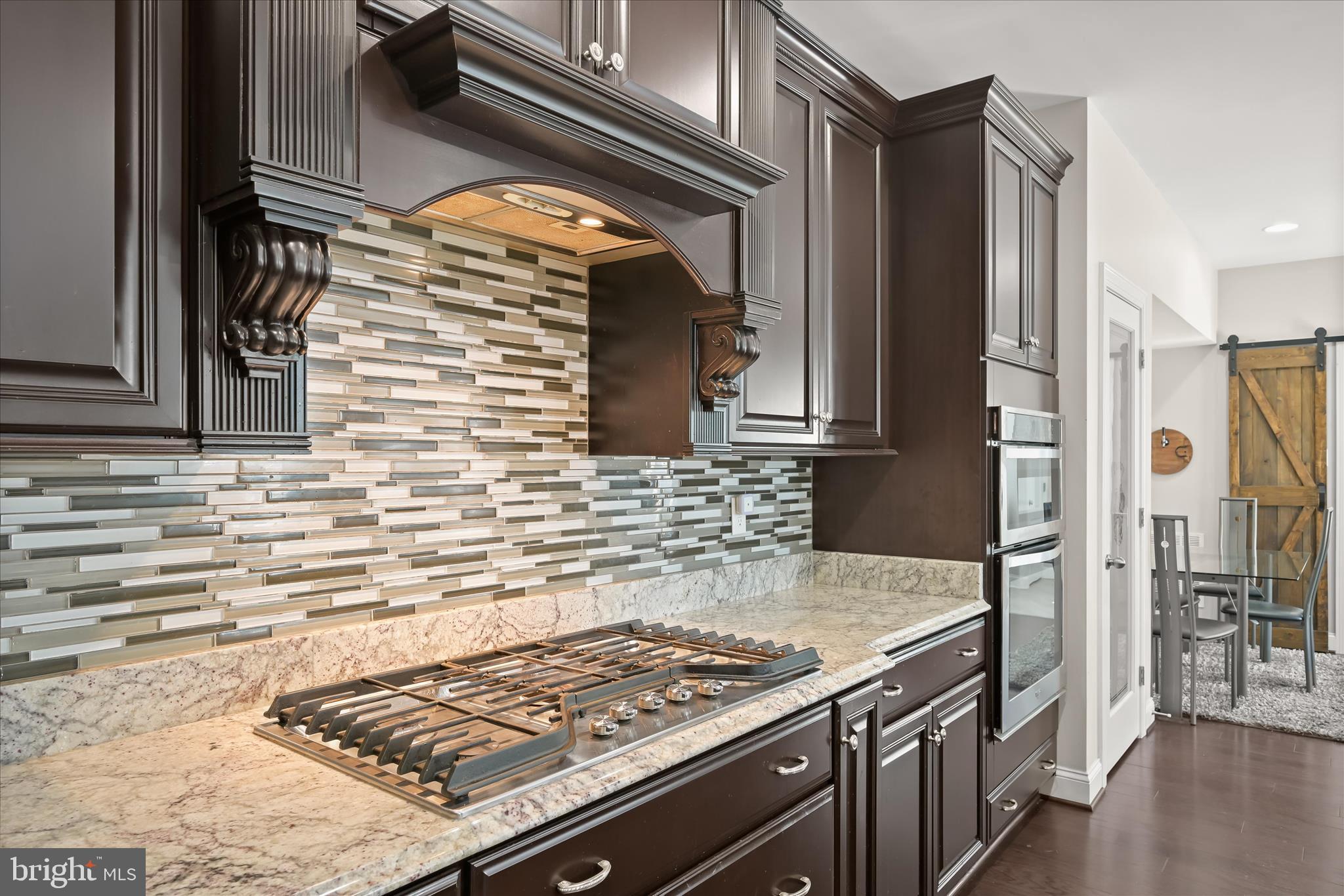11295 Market Street Fulton, MD 20759 - Photo 21 of 59 Mosaic tile backsplash & gas cooktop