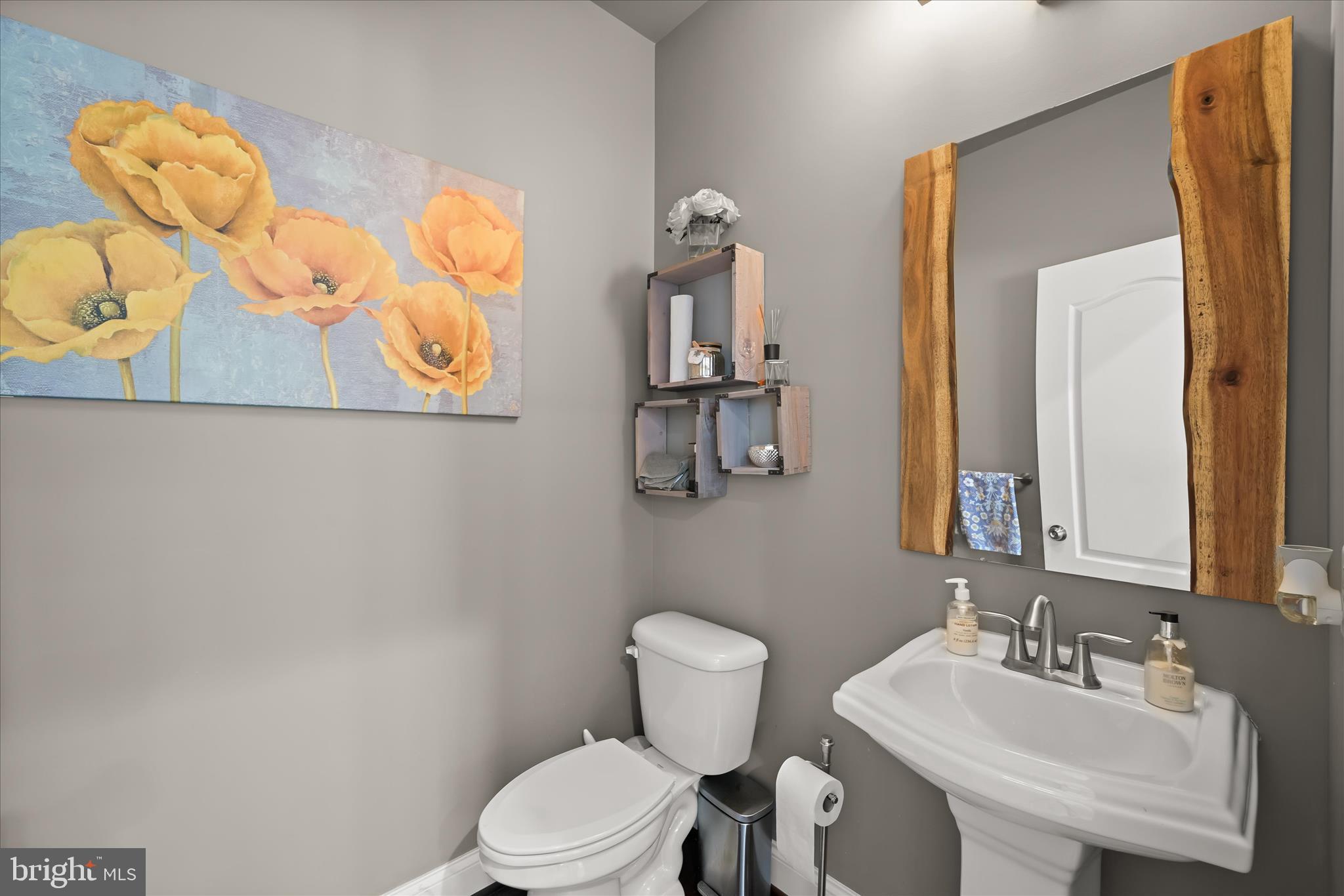 11295 Market Street Fulton, MD 20759 - Photo 30 of 62 a bathroom with a toilet sink and mirror