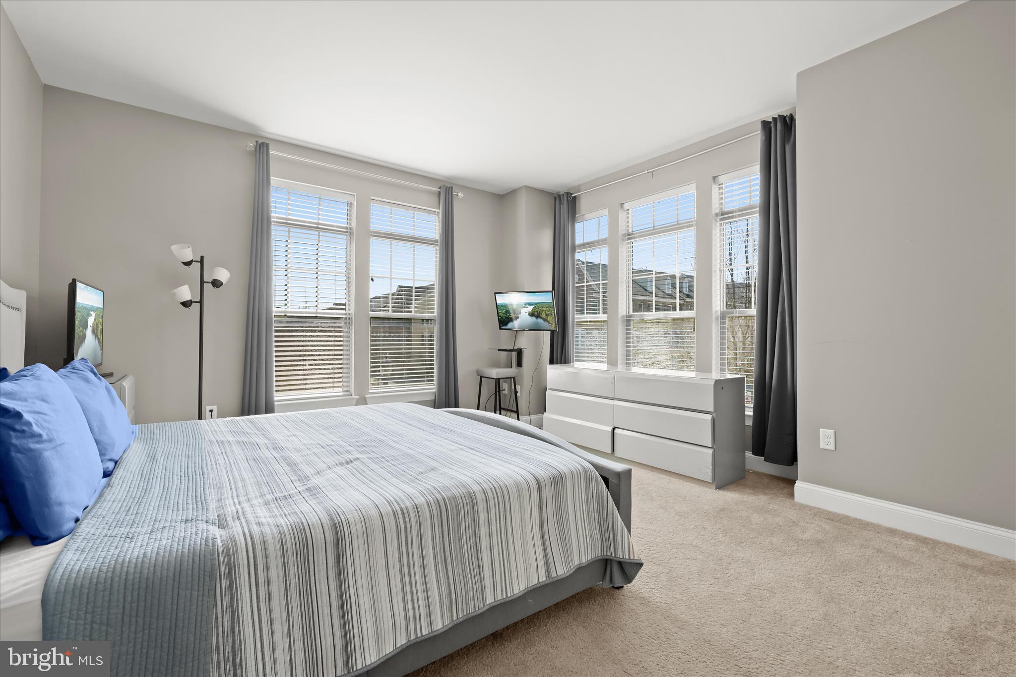 11295 Market Street Fulton, MD 20759 - Photo 37 of 62 a bedroom with a large bed and a large window