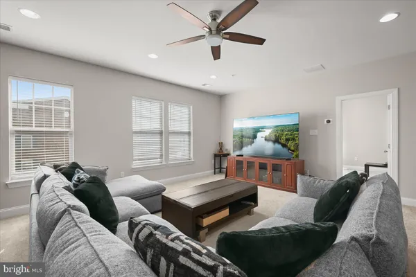 a bedroom with a large bed and a night stand