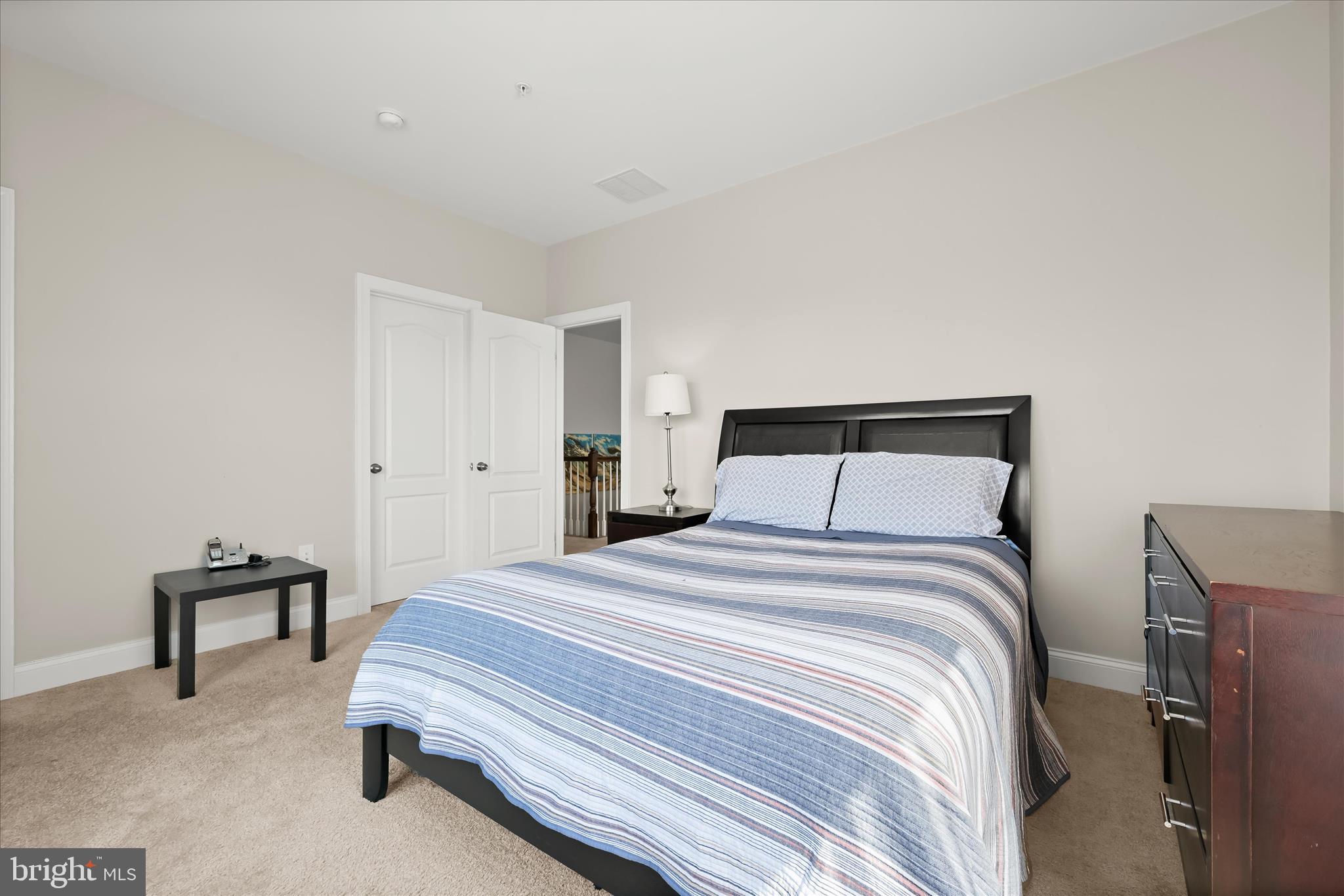 11295 Market Street Fulton, MD 20759 - Photo 46 of 62 a bedroom with a bed and a chair