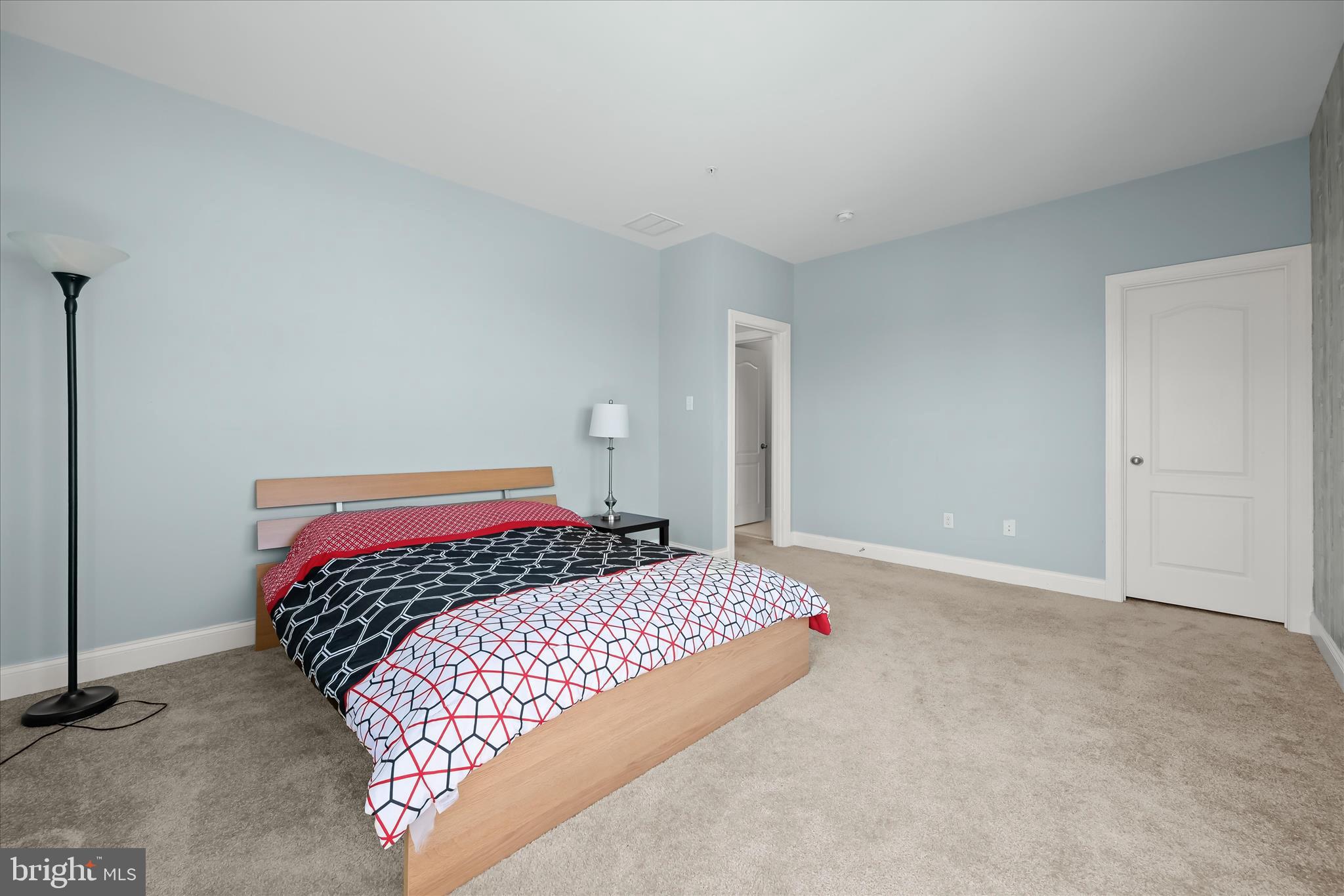11295 Market Street Fulton, MD 20759 - Photo 49 of 62 a bedroom with a large bed and a night stand