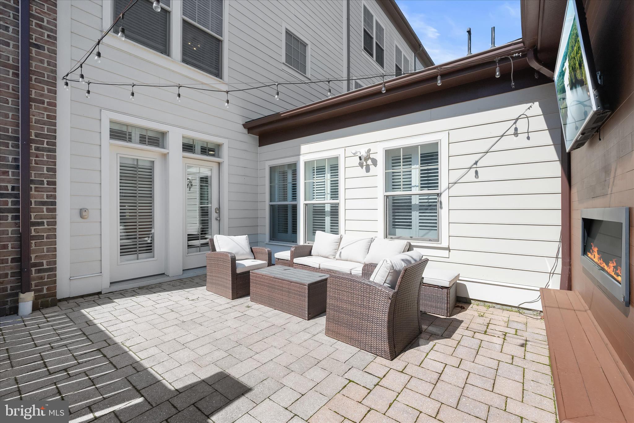 11295 Market Street Fulton, MD 20759 - Photo 53 of 62 a view of a patio with couches table and chairs with wooden floor and fence