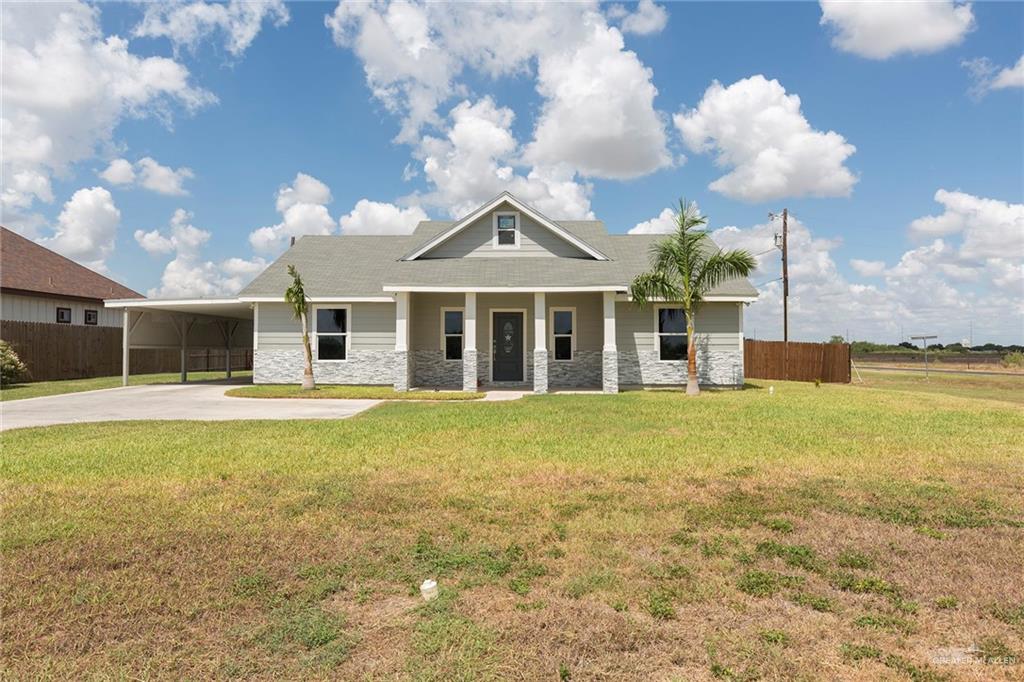 1337 North Cesar Chavez Road Edinburg, TX 78542 - Photo 1 of 1 A charming stucco and stone home with a warm, inviting exterior -features arched windows and a rustic wooden door. The front porch adds country charm and the interior bathes you in modern luxury.