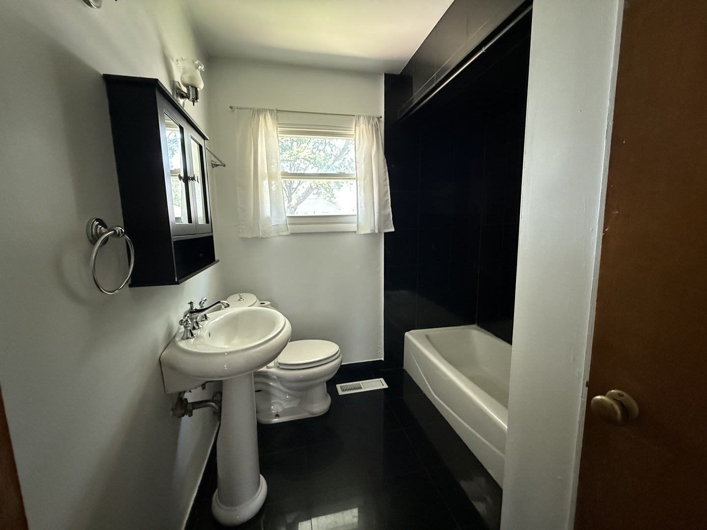 29 Roslyn Road Westmont, IL 60559 - Photo 6 of 11 a bathroom with a sink toilet and a mirror