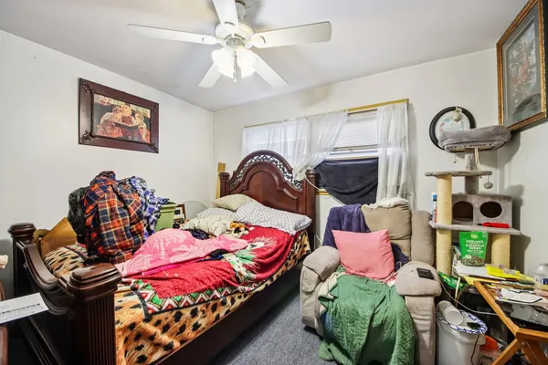 a bedroom with two beds and a window