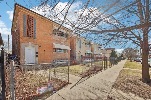 a view of a building with a tree
