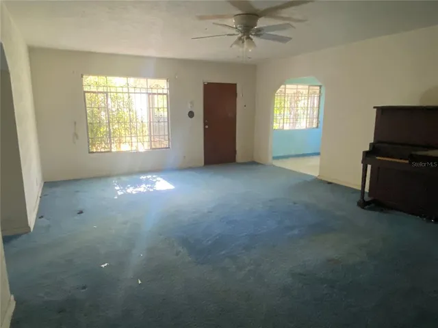 a view of an empty room with a window