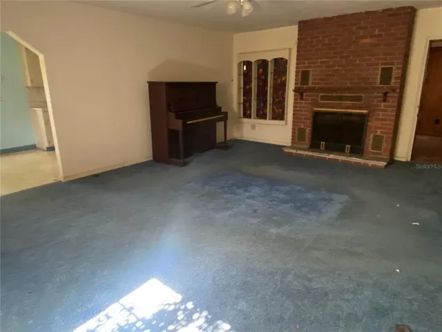 a view of livingroom with furniture and fireplace