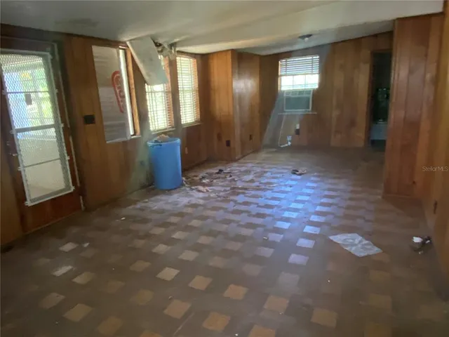 a view of entryway with stairs and wooden floor