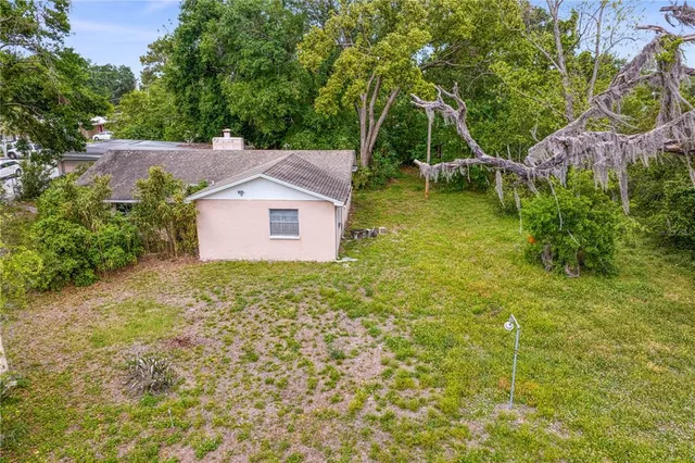 a view of a house with a yard and plants