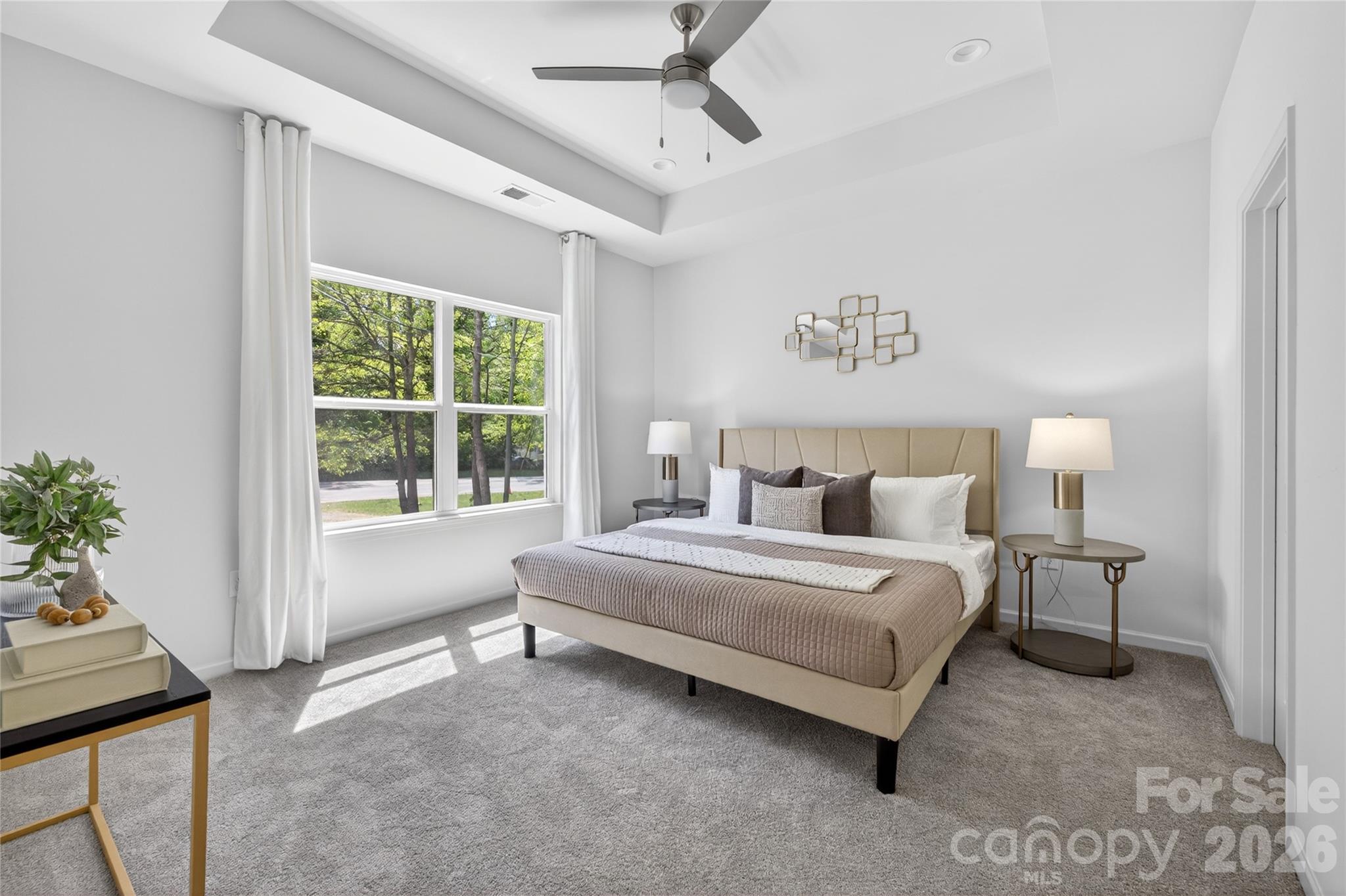 9212 Moores Chapel Road Charlotte, NC 28214 - Photo 11 of 23 a spacious bedroom with a bed and a window