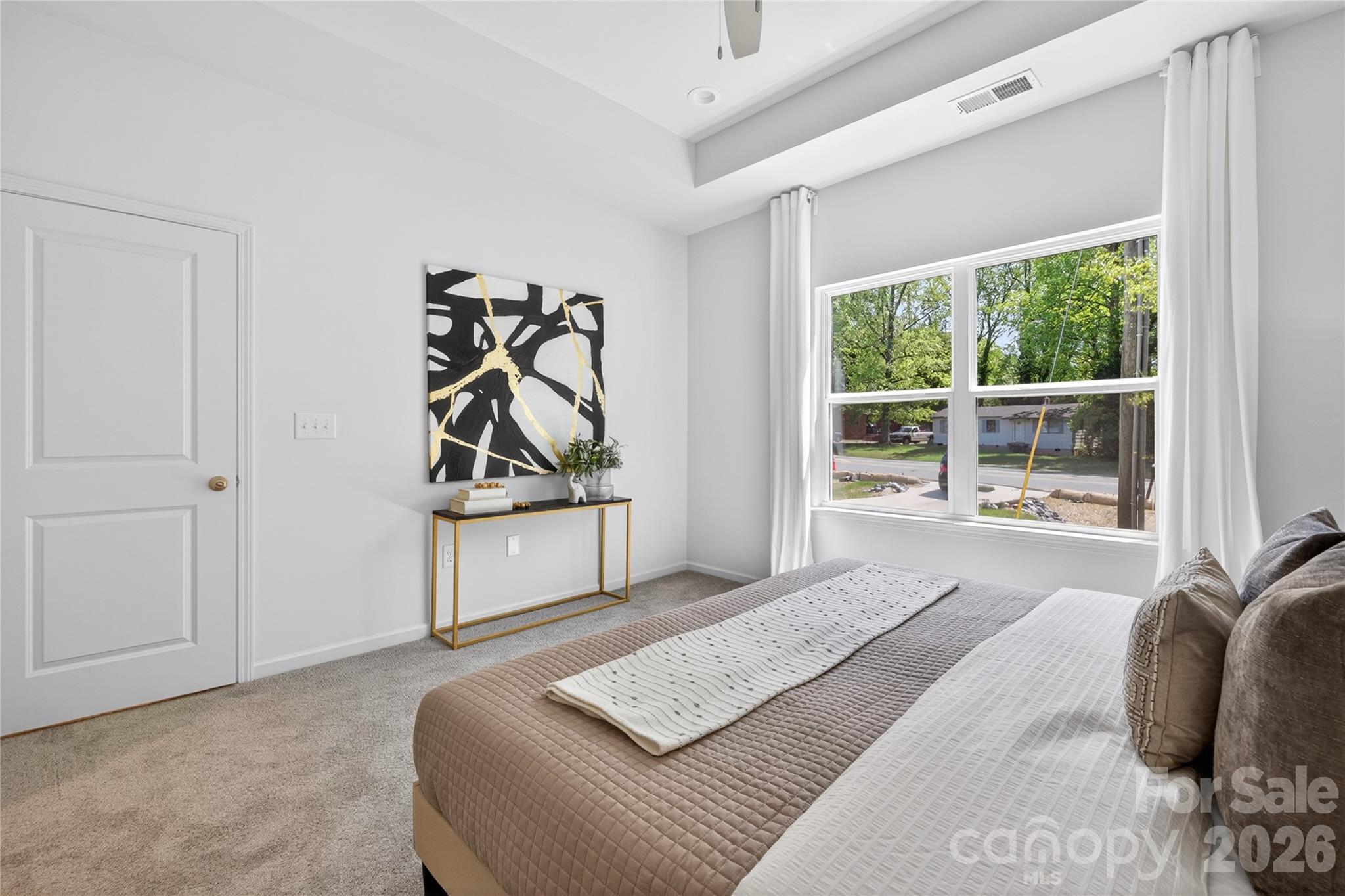 9212 Moores Chapel Road Charlotte, NC 28214 - Photo 13 of 23 a bedroom with a bed and a window