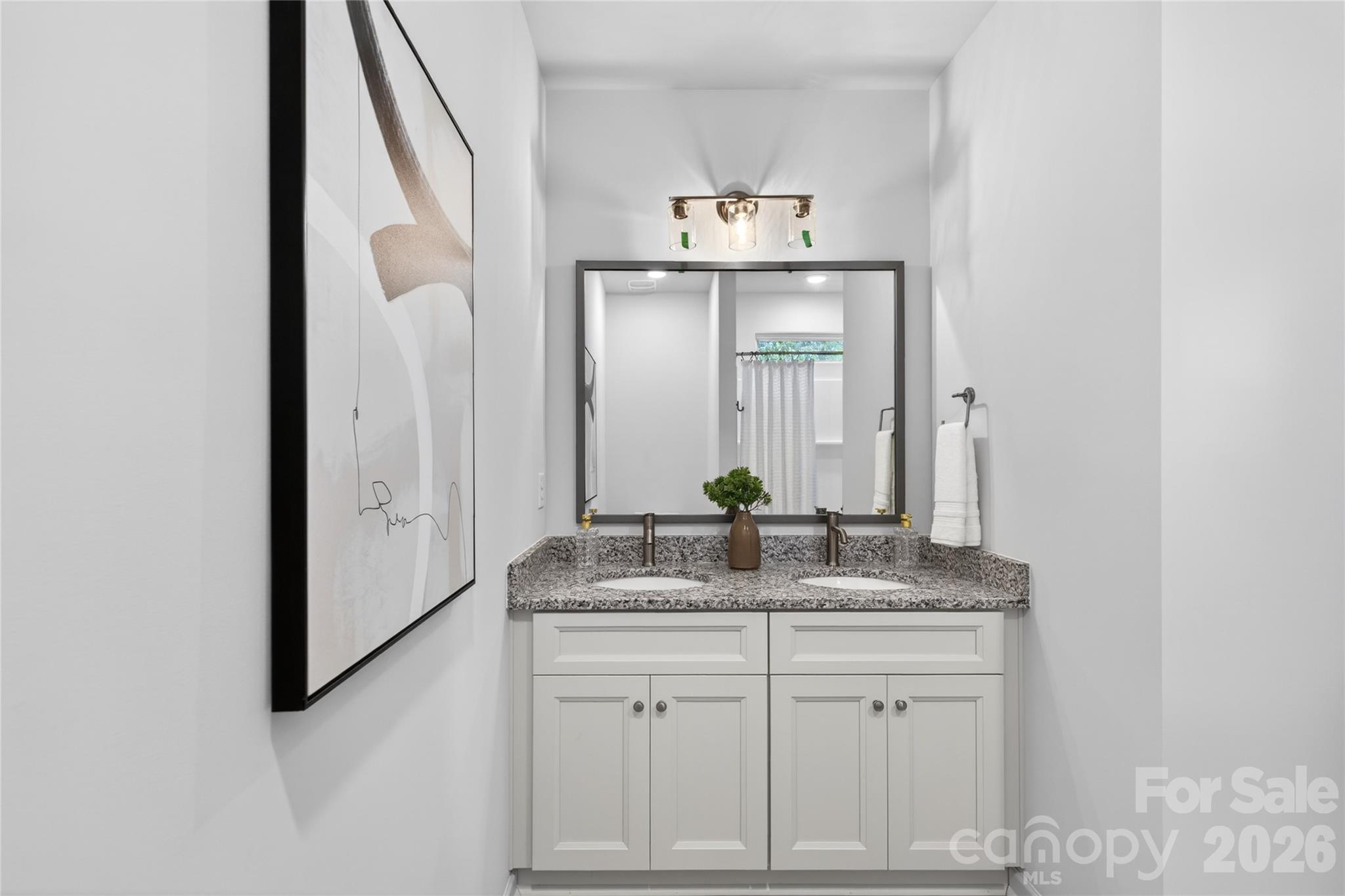 9212 Moores Chapel Road Charlotte, NC 28214 - Photo 14 of 23 a bathroom with a granite countertop sink and a mirror