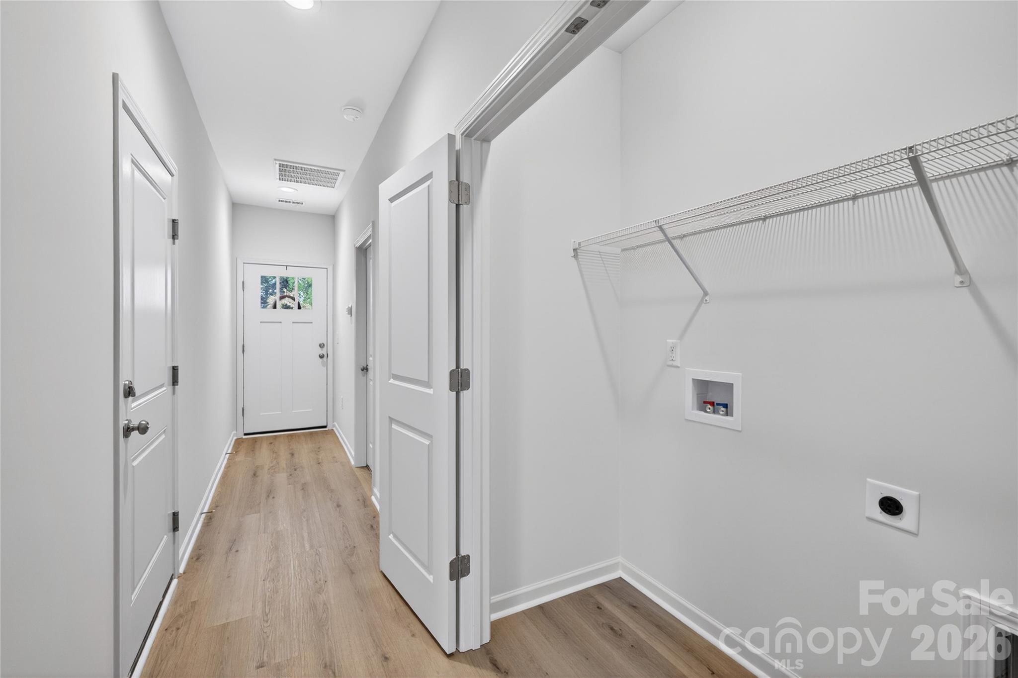 9212 Moores Chapel Road Charlotte, NC 28214 - Photo 18 of 23 a view of a hallway with wooden floor and closet area