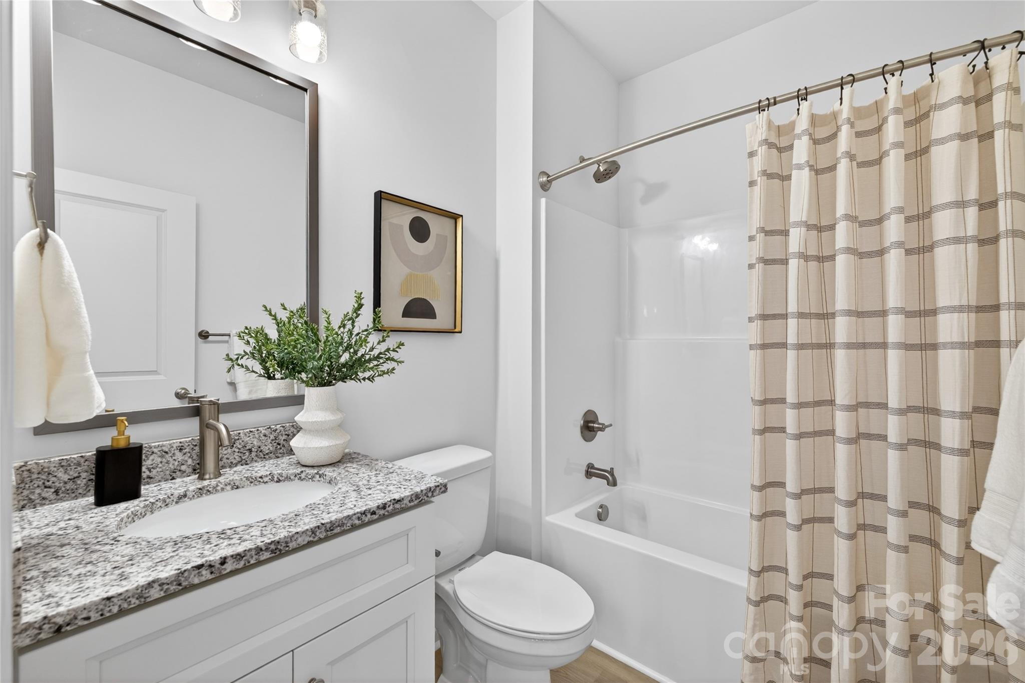 9212 Moores Chapel Road Charlotte, NC 28214 - Photo 19 of 23 a bathroom with a granite countertop sink a toilet and shower