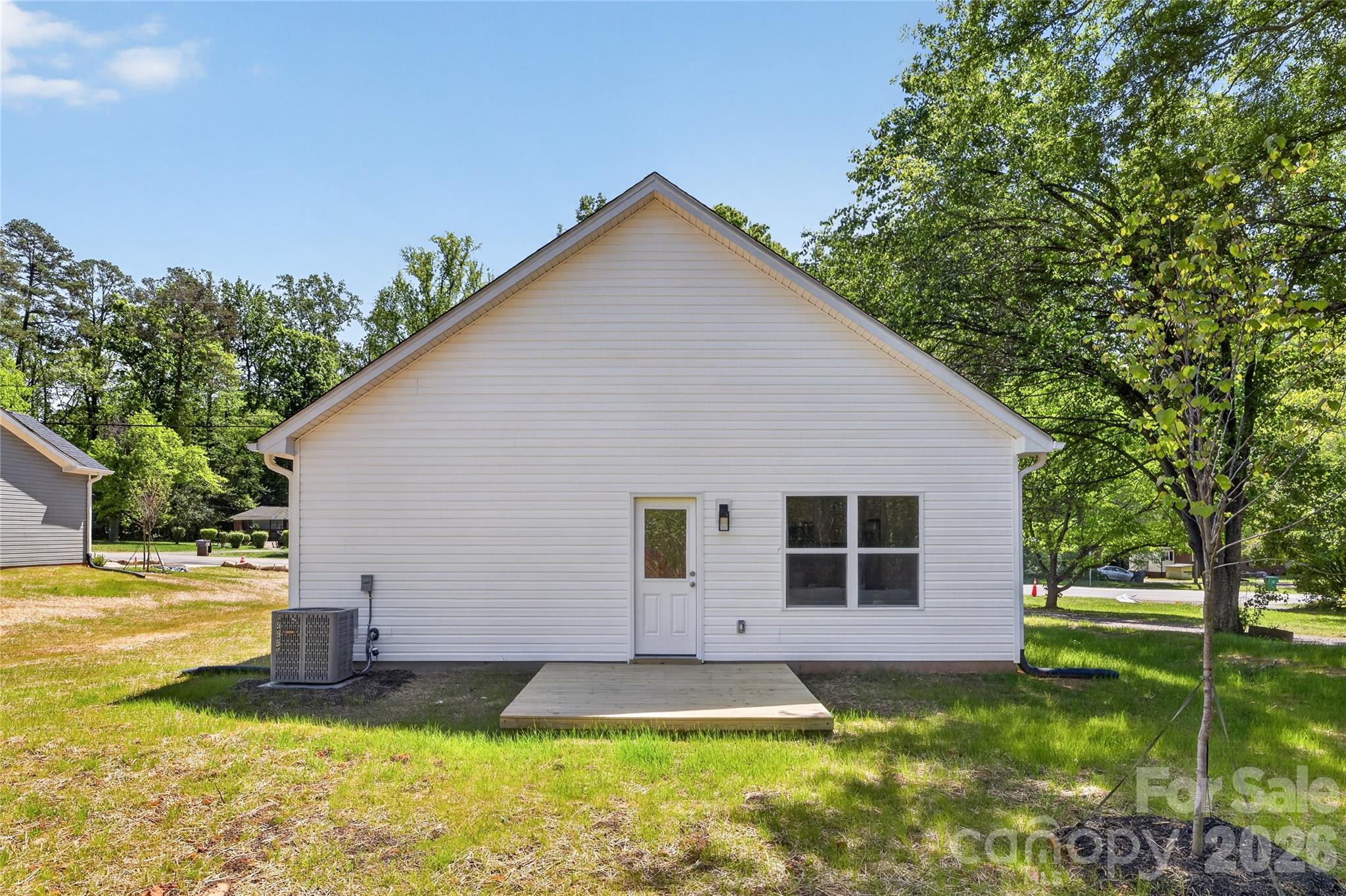 9212 Moores Chapel Road Charlotte, NC 28214 - Photo 21 of 23 a front view of a house with a yard