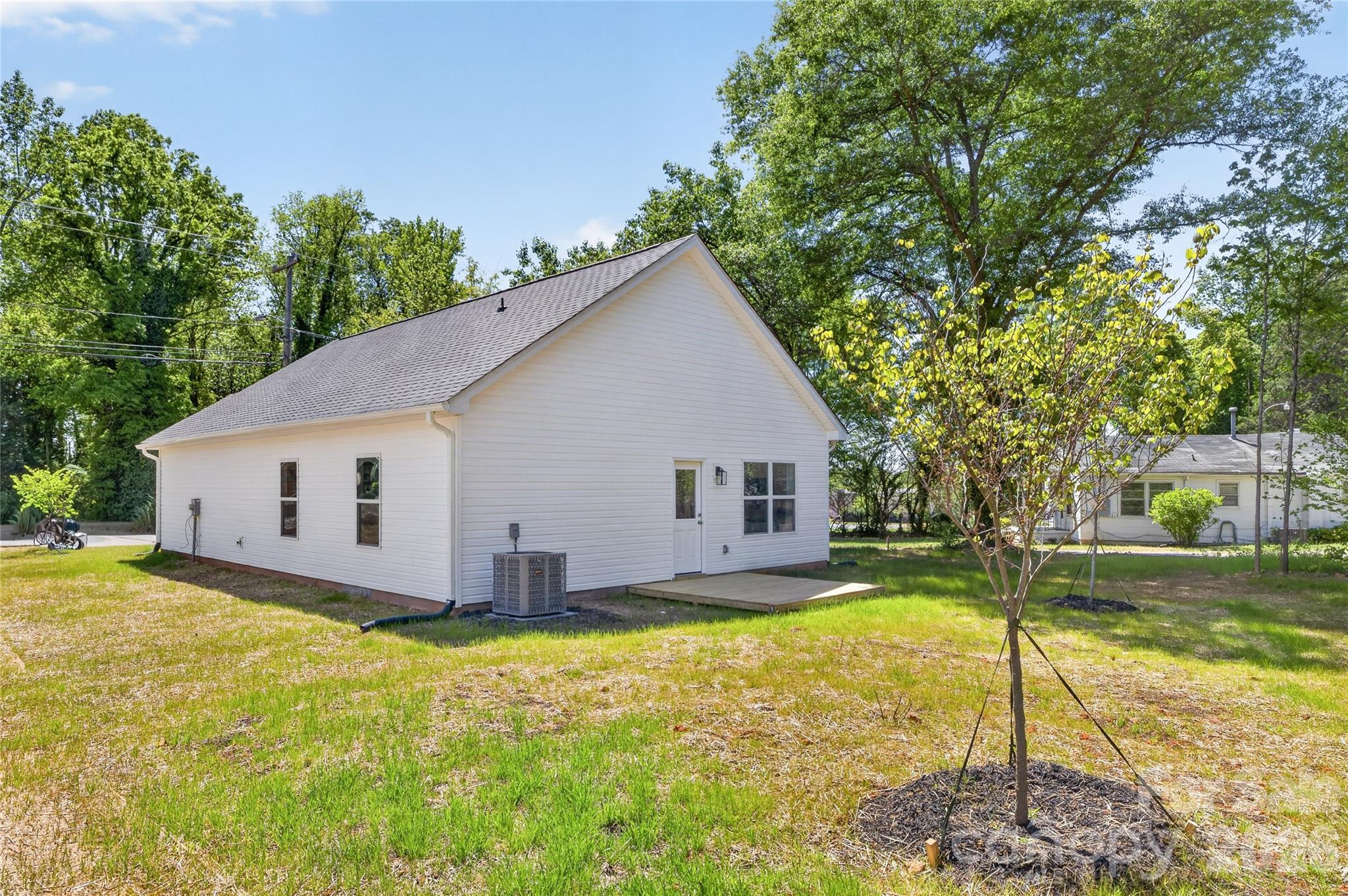 9212 Moores Chapel Road Charlotte, NC 28214 - Photo 22 of 23 a view of a house with a yard