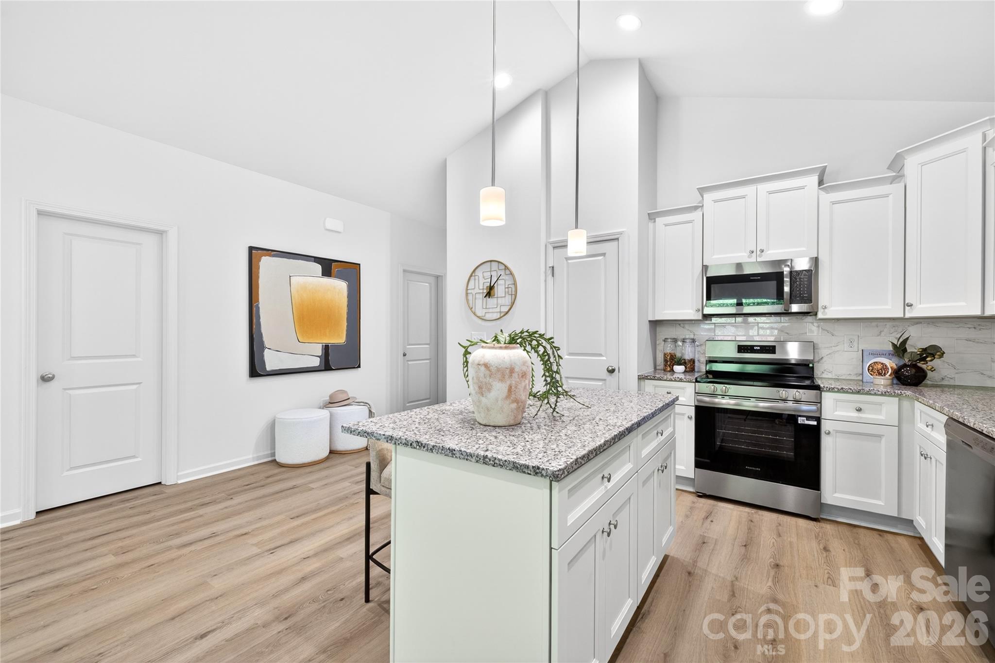 9212 Moores Chapel Road Charlotte, NC 28214 - Photo 6 of 23 a kitchen with stainless steel appliances granite countertop a stove a sink and a microwave