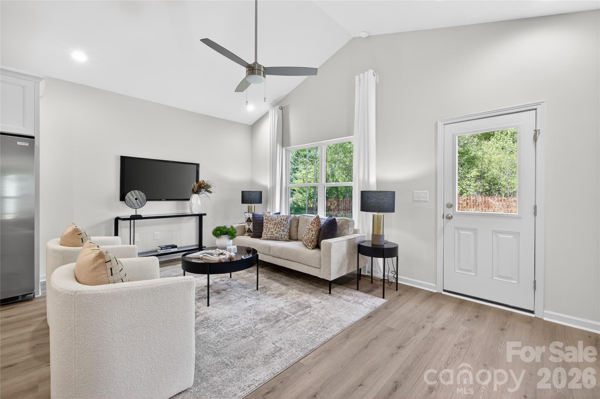 9212 Moores Chapel Road Charlotte, NC 28214 - Photo 8 of 23 a living room with furniture and a flat screen tv