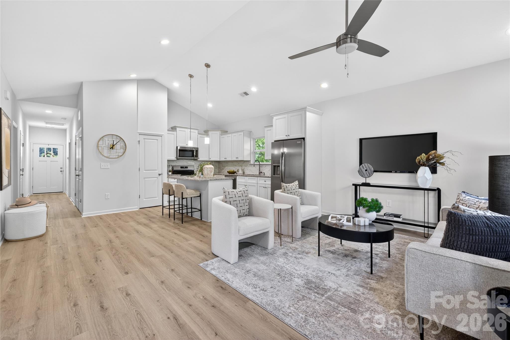 9212 Moores Chapel Road Charlotte, NC 28214 - Photo 9 of 23 a living room with furniture and a flat screen tv