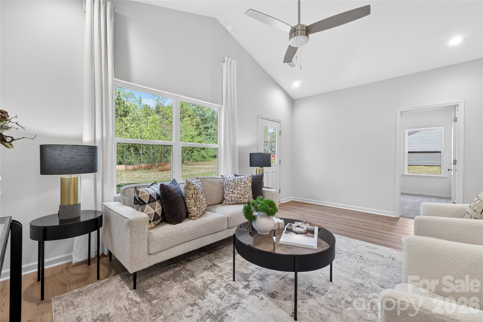 9212 Moores Chapel Road Charlotte, NC 28214 - Photo 10 of 23 a living room with furniture and a large window