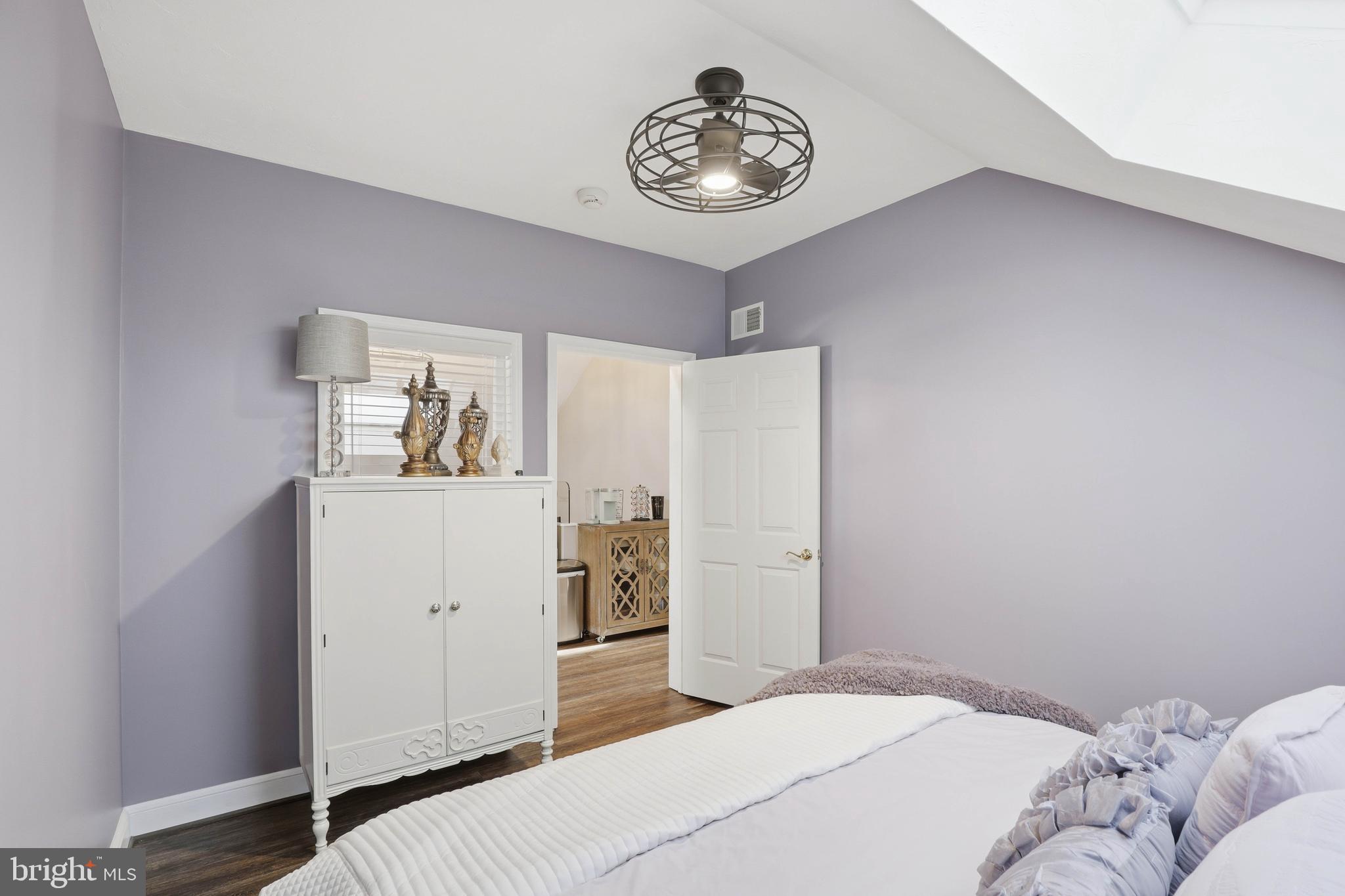 252 Frederick Street Hanover, PA 17331 - Photo 81 of 107 a bedroom with a bed and a chandelier