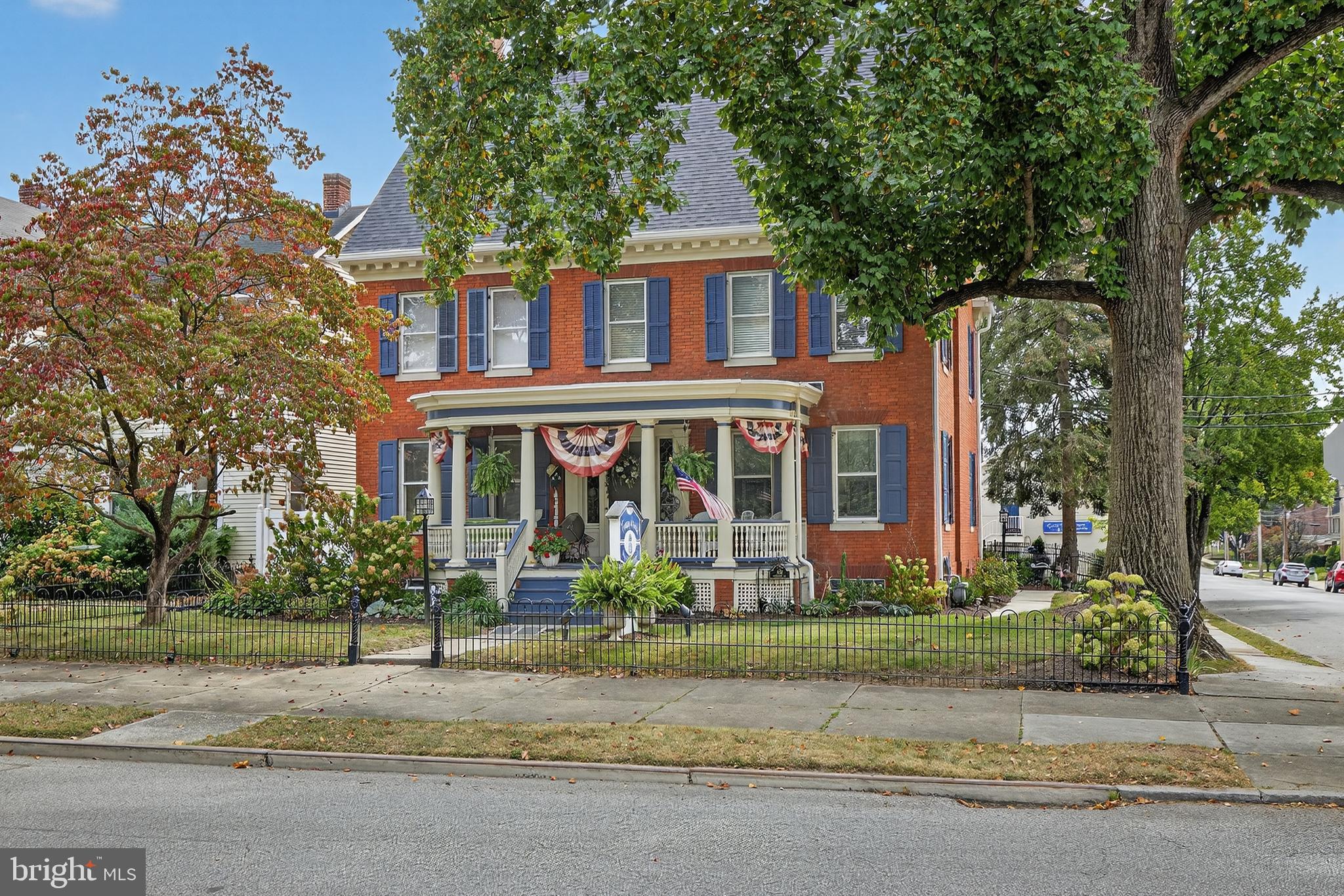 252 Frederick Street Hanover, PA 17331 - Photo 96 of 107 front view of a brick house with a yard