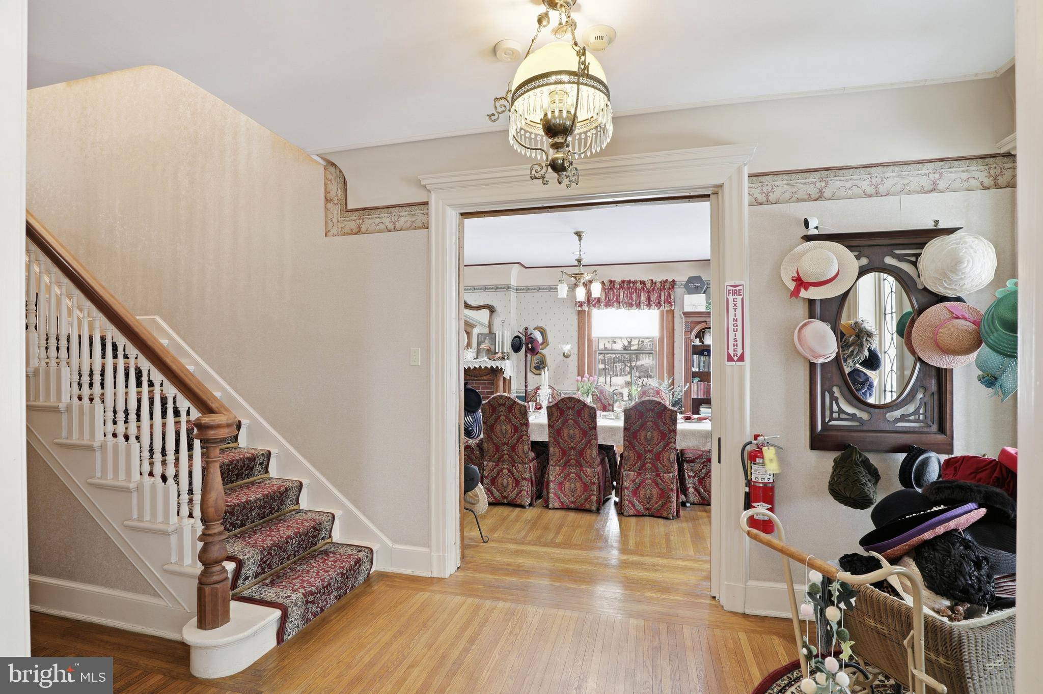252 Frederick Street Hanover, PA 17331 - Photo 10 of 107 a view of a room with wooden floor and lots of frames on the wall