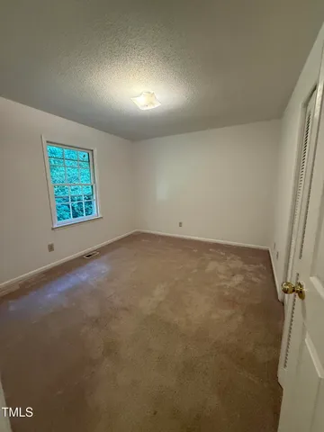 a white toilet sitting next to a sink